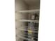 Utility closet with shelving and a hot water tank at 5423 Sweetwater Terrace Cir, Tampa, FL 33634