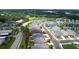 An aerial view shows the property surrounded by green lawns and mature trees in a well-maintained community at 5546 Spanish Moss Cv, Bradenton, FL 34203