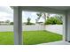 Backyard space features a lush green lawn enclosed by a tall white fence, offering privacy and ample space at 5546 Spanish Moss Cv, Bradenton, FL 34203