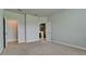 Spacious bedroom featuring neutral carpeting, en-suite bathroom and an additional room at 5546 Spanish Moss Cv, Bradenton, FL 34203