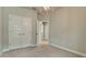 Neutral bedroom featuring carpeting, base trim, and doorways to other rooms in the home at 5546 Spanish Moss Cv, Bradenton, FL 34203