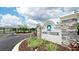 The Moss Creek community entrance features a stone sign, landscaping, and a secure gated entry at 5546 Spanish Moss Cv, Bradenton, FL 34203