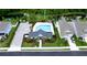 Overhead shot of the community pool area, highlighting the pool, lounge chairs, and surrounding landscaping at 5546 Spanish Moss Cv, Bradenton, FL 34203