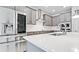 Stylish kitchen featuring gray cabinets, stainless steel appliances, and a quartz countertop at 5546 Spanish Moss Cv, Bradenton, FL 34203