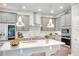 Bright kitchen with modern stainless appliances and white quartz countertop at 5546 Spanish Moss Cv, Bradenton, FL 34203