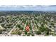 An aerial view of the neighborhood showcasing lush trees, nearby streets, and an overall sense of community at 5690 82Nd N Ter, Pinellas Park, FL 33781