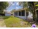 Exterior view of the screened-in patio and backyard with a shed at 5690 82Nd N Ter, Pinellas Park, FL 33781