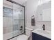 Bathroom featuring a tub and shower with glass doors, a new toilet, and a vanity at 5690 82Nd N Ter, Pinellas Park, FL 33781