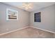 Compact bedroom with neutral walls and carpet, offering a simple and peaceful retreat at 5690 82Nd N Ter, Pinellas Park, FL 33781