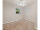 Simple bedroom with large window and ceiling fan offers a quiet and comfortable space at 5690 82Nd N Ter, Pinellas Park, FL 33781