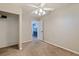 Neutral bedroom with a view into the kitchen, offering simple design and plenty of natural light at 5690 82Nd N Ter, Pinellas Park, FL 33781
