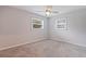 Bedroom with neutral-colored walls and carpet, plus two windows with blinds at 5690 82Nd N Ter, Pinellas Park, FL 33781