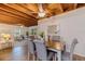 Cozy dining area with exposed wood beam ceiling, seamlessly connected to the living space, offering a relaxed setting at 5690 82Nd N Ter, Pinellas Park, FL 33781