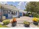 Close-up of a cozy blue home with inviting front yard decor and a neatly paved driveway leading to a garage at 5690 82Nd N Ter, Pinellas Park, FL 33781