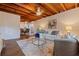 Open concept living room featuring wood beam ceiling and modern decor at 5690 82Nd N Ter, Pinellas Park, FL 33781