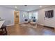 Bright living area with cozy chairs, natural light, and wood flooring, creating an inviting and comfortable atmosphere at 5690 82Nd N Ter, Pinellas Park, FL 33781