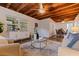 Inviting living room featuring beautiful wood beam ceilings, stylish furnishings, and plenty of natural light at 5690 82Nd N Ter, Pinellas Park, FL 33781