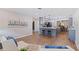Open-concept space showcasing the kitchen, living, and dining areas with modern furnishings and stylish decor at 5690 82Nd N Ter, Pinellas Park, FL 33781
