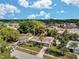 An aerial view showcases the single-story home's landscaping, roof and proximity to neighborhood amenities at 5936 13Th Ave, New Port Richey, FL 34652
