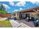 Backyard patio includes dining set and covered patio with outdoor furniture at 5936 13Th Ave, New Port Richey, FL 34652