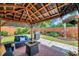 Charming outdoor living space with seating, patio area, and well-maintained lawn at 5936 13Th Ave, New Port Richey, FL 34652