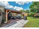This backyard patio boasts a covered gazebo with outdoor seating and a grill, perfect for entertaining guests at 5936 13Th Ave, New Port Richey, FL 34652