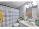 Bright bathroom featuring neutral colors, a shower-tub combo, and modern fixtures at 5936 13Th Ave, New Port Richey, FL 34652