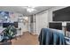 Cozy bedroom with a computer desk and mounted televisions with closet access at 5936 13Th Ave, New Port Richey, FL 34652