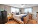 Bedroom with a wooden bed frame, two side tables, and a large window at 5936 13Th Ave, New Port Richey, FL 34652