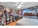 Whimsical bedroom featuring posters, a desk, and a ceiling fan at 5936 13Th Ave, New Port Richey, FL 34652