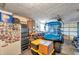 Spacious garage with tool storage, workbench, and room for vehicle at 5936 13Th Ave, New Port Richey, FL 34652