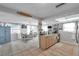 Open kitchen and dining area with updated appliances and plenty of natural light at 5936 13Th Ave, New Port Richey, FL 34652