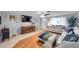 Cozy living room with stylish decor, a large television, and comfortable seating, perfect for relaxation at 5936 13Th Ave, New Port Richey, FL 34652