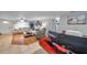 Bright living room with hardwood floors, plush seating, and abundant natural light at 5936 13Th Ave, New Port Richey, FL 34652
