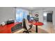 Home office featuring a large curved desk, dual monitors, and ample workspace at 5936 13Th Ave, New Port Richey, FL 34652
