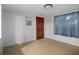 A bedroom with a door and window at 6006 Axelrod Rd, Tampa, FL 33634
