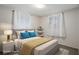A staged bedroom with natural light and shelving at 6006 Axelrod Rd, Tampa, FL 33634
