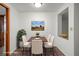 A staged dining room with a painting and chairs at 6006 Axelrod Rd, Tampa, FL 33634