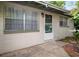 Charming single-story home featuring a bright front entrance with secure screen door and lovely curb appeal at 6006 Axelrod Rd, Tampa, FL 33634