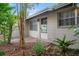 Charming single-story home featuring a bright front entrance and mature landscaping at 6006 Axelrod Rd, Tampa, FL 33634