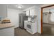 A kitchen with white cabinets and stainless steel appliances at 6006 Axelrod Rd, Tampa, FL 33634