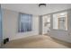 Bright living room features neutral walls and a view into the kitchen at 6006 Axelrod Rd, Tampa, FL 33634