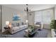 This virtually staged living room has contemporary furnishings and decor at 6006 Axelrod Rd, Tampa, FL 33634