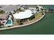 Waterfront home featuring lush landscaping, a private pool, and beautiful curb appeal at 649 Normandy Rd, Madeira Beach, FL 33708