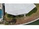Home featuring screened in patio overlooking well maintained landscaping and waterfront access at 649 Normandy Rd, Madeira Beach, FL 33708