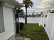 Home with direct access to the canal and featuring lush green landscaping at 649 Normandy Rd, Madeira Beach, FL 33708