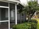Screened in patio perfect for outdoor entertaining and features lush landscaping at 649 Normandy Rd, Madeira Beach, FL 33708