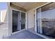 Private balcony with sliding glass doors leading to an open-concept living space and peaceful views at 6826 Stones Throw N Cir # 11308, St Petersburg, FL 33710