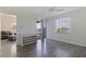 Spacious bedroom featuring neutral walls, modern ceiling fan, wide window, wood flooring, and balcony access at 6826 Stones Throw N Cir # 11308, St Petersburg, FL 33710