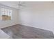 Spacious bedroom featuring neutral walls, modern ceiling fan, wide window and wood flooring at 6826 Stones Throw N Cir # 11308, St Petersburg, FL 33710